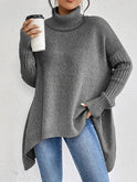 Light gray oversized ribbed turtleneck sweater with longline fit from Lumina Wear, displayed flat on a white background.