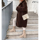 Lumina Wear Isabella plush textured high collar winter overcoat for women, showcasing cozy fabric and stylish design.