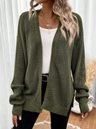 Black pointelle knit women's cardigan sweater with side split hem by Lumina Wear, featuring a relaxed fit and open front style.