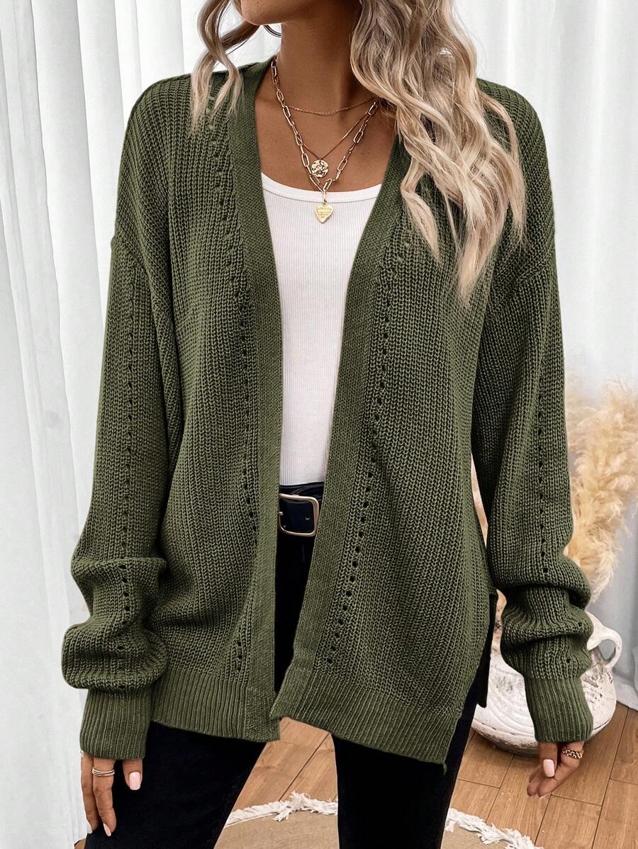 Black pointelle knit women's cardigan sweater with side split hem by Lumina Wear, featuring a relaxed fit and open front style.