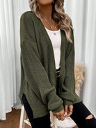 Black pointelle knit women's cardigan sweater with side split hem from Lumina Wear's Isabella collection.