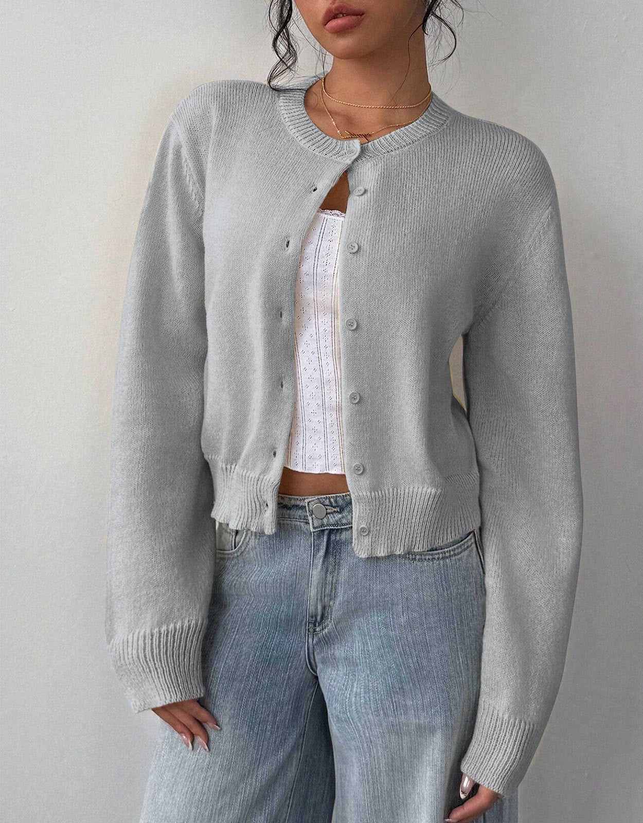 Relaxed white cropped cardigan sweater with ribbed trim by Lumina Wear, styled with open front and long sleeves.