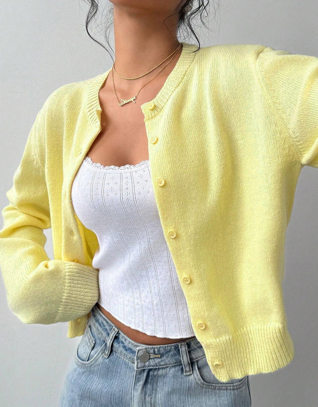 White cropped cardigan sweater with ribbed trim from Lumina Wear, featuring a relaxed fit and casual style.