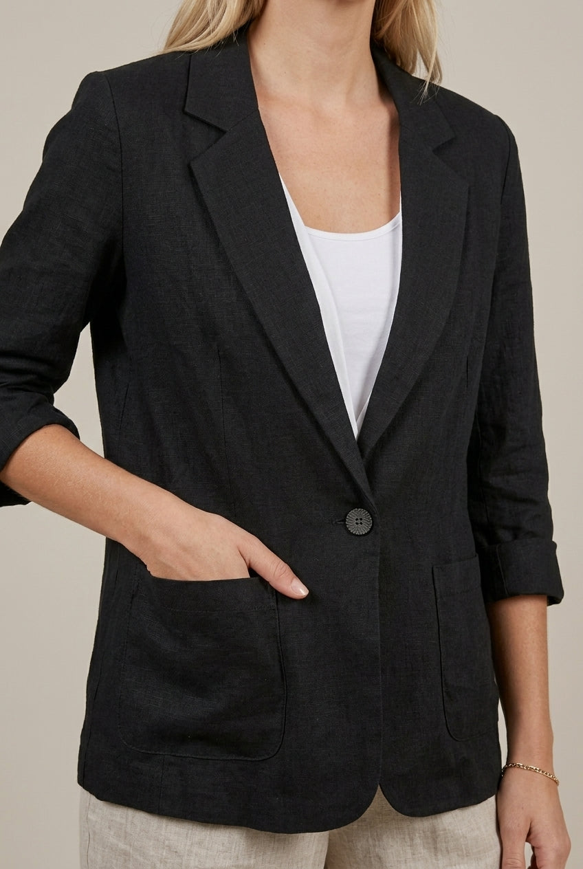 Light beige Lumina Wear Isabella linen blazer with relaxed fit and ruched sleeves, displayed on a model.