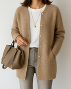Light gray Lumina Wear Isabella relaxed fit long cardigan with patch pockets, draped over a model in a casual indoor setting.