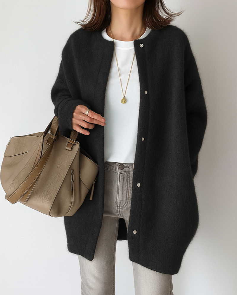 Light gray Lumina Wear Isabella relaxed fit long cardigan with patch pockets, displayed hanging on a wooden hanger.