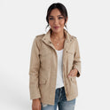 Lumina Wear Isabella relaxed fit utility jacket with adjustable collar, shown in a stylish outdoor setting.