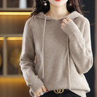 Lumina Wear Isabella relaxed hooded knit sweater for women, featuring soft textured fabric and a cozy, casual fit.