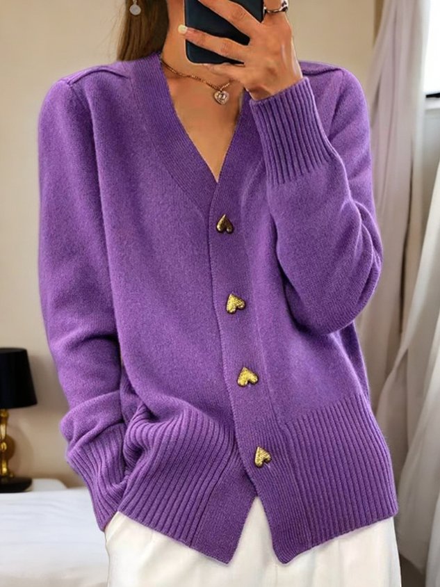White longline cardigan sweater for women with heart button details, from Lumina Wear, styled casually.