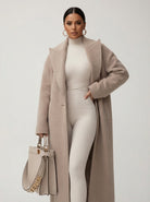Relaxed oversized wool-blend overcoat with shawl collar by Lumina Wear, shown in a neutral color on a model.