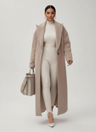 Isabella Lumina relaxed oversized wool-blend overcoat with shawl collar, displayed on a hanger showing its cozy, stylish design.