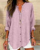 Light blue and white striped Lumina Wear Isabella relaxed blouse with button front and long sleeves, casual and stylish for everyday wear.