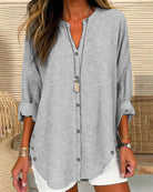 Isabella Lumina relaxed striped blouse with button front, featuring casual fit and lightweight fabric, displayed on a hanger.