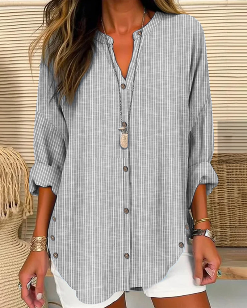 Isabella Lumina relaxed striped blouse with button front, featuring casual fit and lightweight fabric, displayed on a hanger.