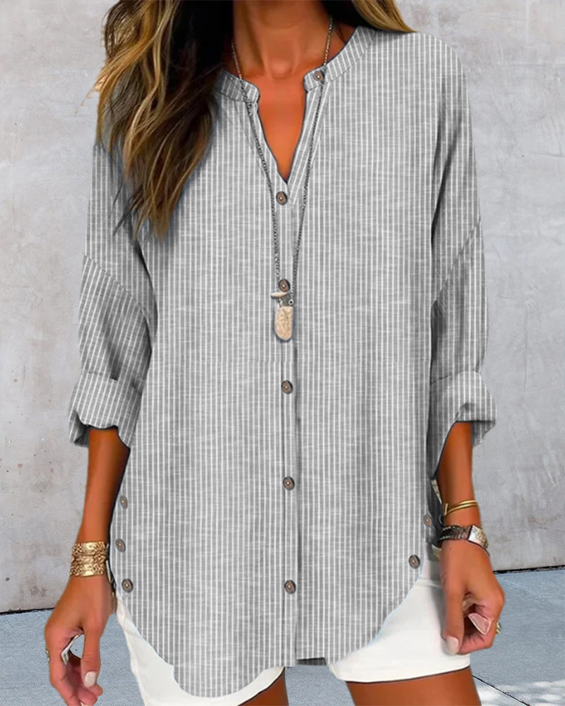 Light blue and white striped Lumina Wear Isabella relaxed blouse with button front and long sleeves, casual and stylish.