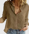 Light beige Lumina Wear Isabella relaxed V-neck blouse with button front, displayed on a hanger.