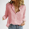 Light blue Lumina Wear Isabella relaxed V-neck blouse with button front, shown on a model, casual stylish top for everyday wear.