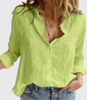 Light gray Lumina Wear Isabella relaxed V-neck blouse with button front and long sleeves, displayed on a hanger.