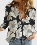 Light blue Lumina Wear Isabella relaxed V-neck blouse with button front, showcased on a hanger.