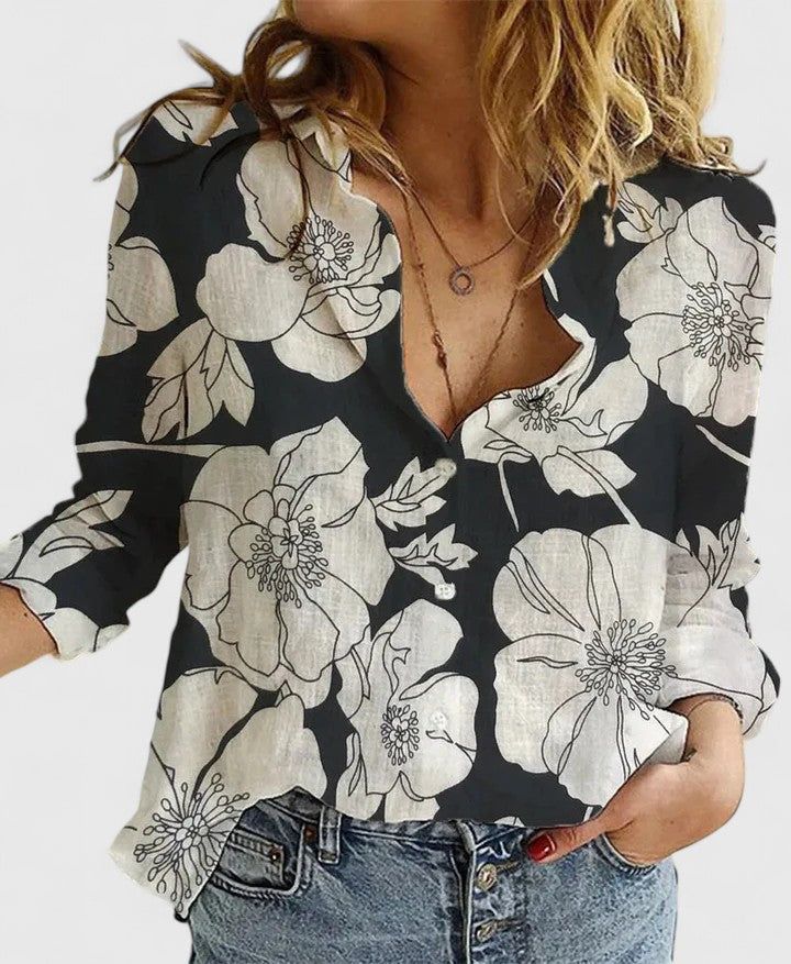 Light beige Lumina Wear Isabella relaxed V-neck blouse with button front, shown on a hanger. Soft fabric and casual style.