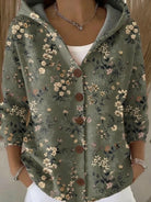 Black ribbed women's cardigan sweater with button front from Lumina Wear, styled with long sleeves and a fitted design.