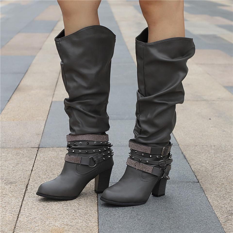 Lumina Wear women's knee-high boots with studded straps, slouch design, and block heel, featuring a stylish and trendy look.