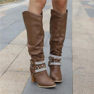 Lumina Wear Isabella women's knee-high boots with studded straps, slouch design, and block heel for stylish footwear.