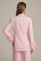 Lumina Wear Isabella tailored blazer with feather cuffs paired with straight-leg trousers, stylish and sophisticated suit ensemble.
