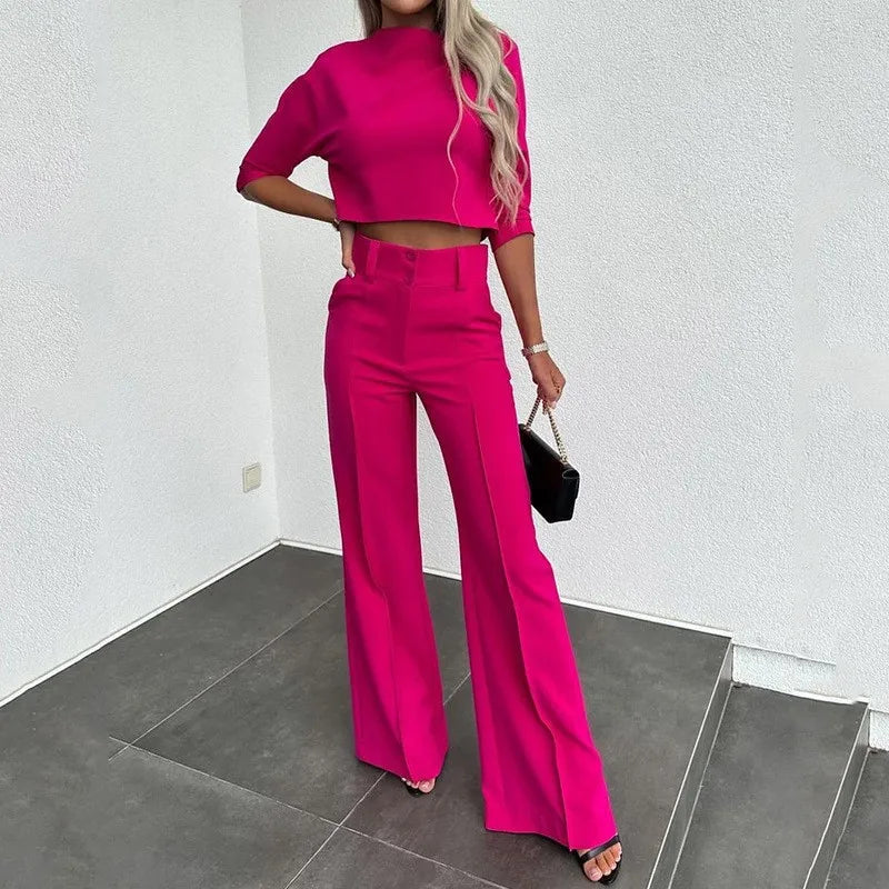 Isabella wearing Lumina Wear Camille tailored crop top and high-rise wide-leg trousers set, featuring a sleek, modern design.