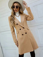 Isabella Lumina Wear tailored double-breasted knee-length overcoat in classic style with structured collar and fitted silhouette.