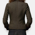 Women's Isabella blazer by Lumina Wear featuring tailored herringbone tweed fabric and velvet cuff details.