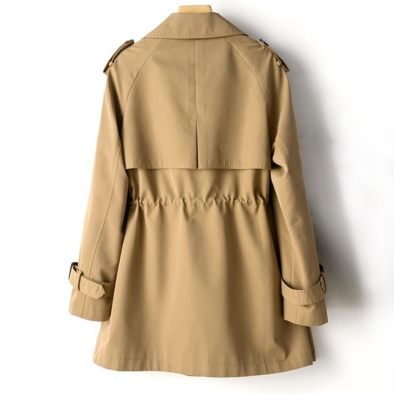 Lightweight tailored trench coat with waist cinch from Lumina Wear, beige color, featuring classic collar and belt detail.
