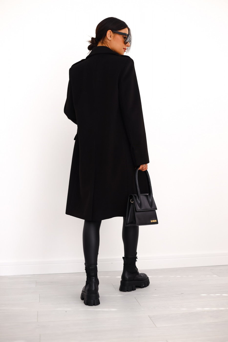 Elegant women's winter trench coat by Lumina Wear featuring a tailored longline design and structured shoulders.