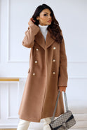 Isabella Lumina Wear tailored longline winter trench coat with structured shoulders, beige fabric, and classic collar detail.