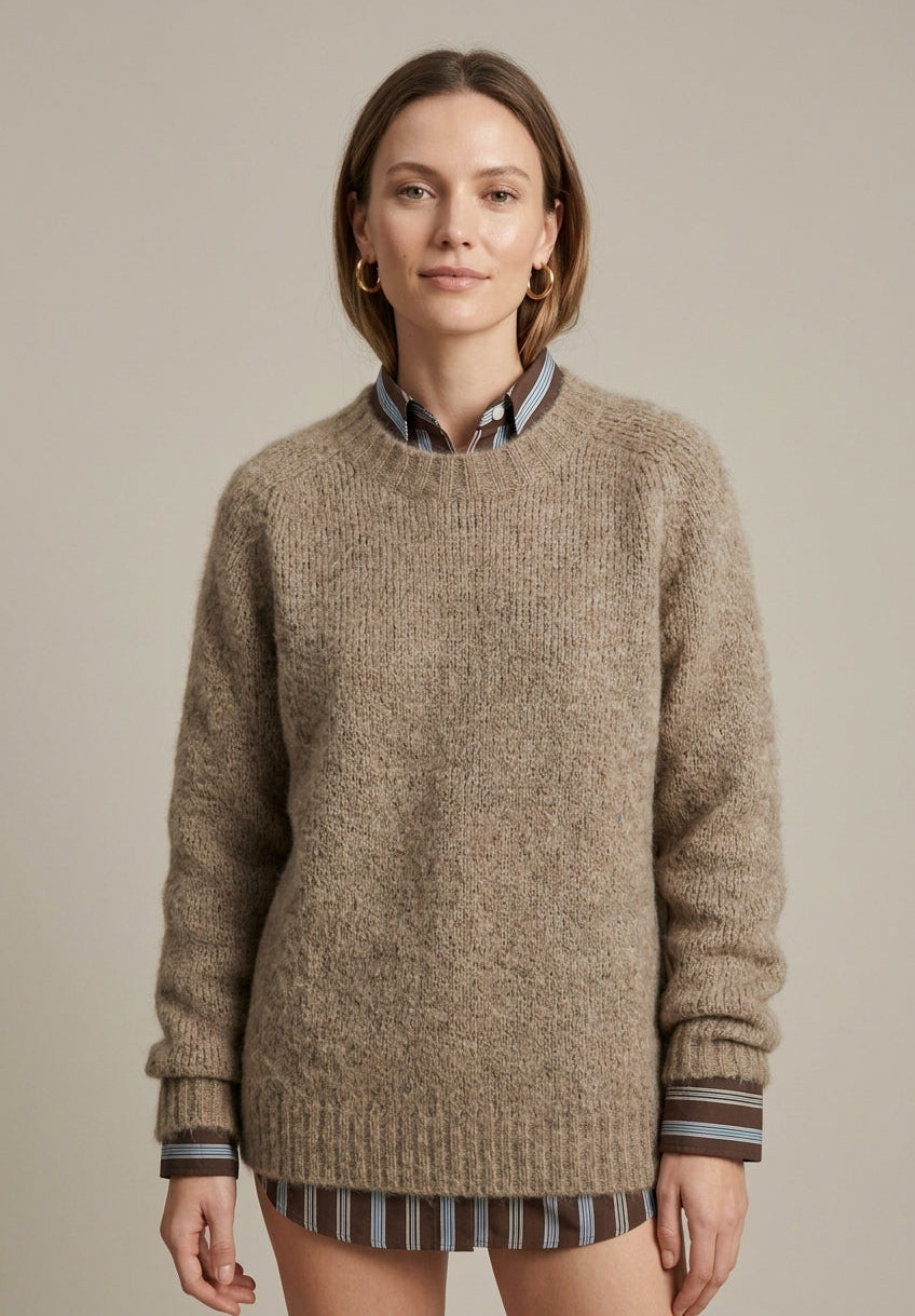 Textured ribbed oversized women's sweater with V-neck from Lumina Wear, featuring a cozy, stylish fit in neutral tones.