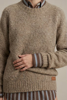 Lumina Wear Isabella textured ribbed oversized women's sweater with V-neck, cozy knit, and relaxed fit in neutral tones.