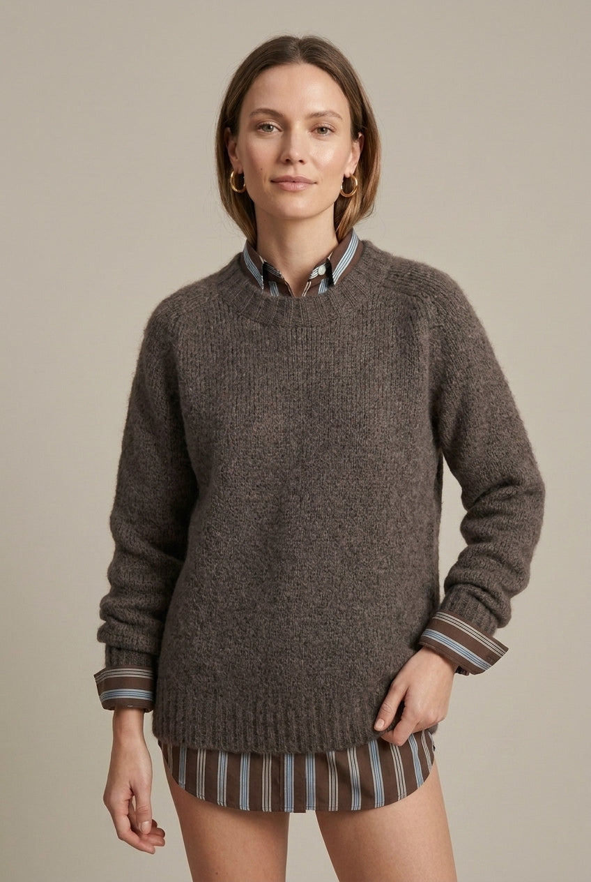 Textured ribbed oversized women's sweater with V-neck by Lumina Wear, shown in a cozy, stylish fit in natural light.