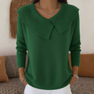 Woman wearing Lumina Wear Isabella V-neck wide collar knit sweater with a regular fit, showcasing soft knit fabric and stylish design.