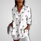 Light blue vintage-inspired Lumina Wear Isabella women's relaxed shirt with a soft, flowing fabric and effortless charm.