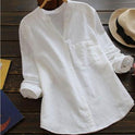 Light blue Lumina Wear Jessica relaxed fit button blouse with classic design, displayed on a hanger against a white background.