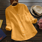 Light blue Jessica relaxed fit button blouse by Lumina Wear, featuring a timeless design and classic collar.