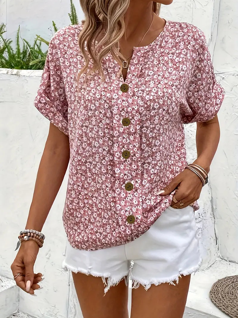 Relaxed floral blouse by Lumina Wear featuring a button front and lightweight fabric, styled with long sleeves and a casual fit.