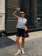 Kylie Lumina Wear relaxed button-front knitted vest with rolled-edge detail, casual sleeveless knit top for layered styling.