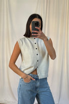 Kylie Lumina Relaxed button-front knitted vest with rolled-edge detail, featuring a casual fit and soft knit fabric.