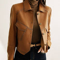 Lucille Lumina Wear cropped oversized faux leather jacket with button closure, featuring a stylish and modern design.