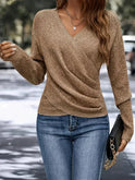 Lumina Wear Madeline women's top with flattering V-neck wrap design and relaxed fit, shown on a model.