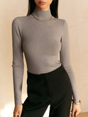 Lumina Wear Maisie women's top with elegant mock neck, relaxed fit, soft fabric, and stylish design.