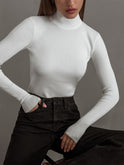 Light beige women's top with elegant mock neck design and relaxed fit by Lumina Wear, shown on a model.