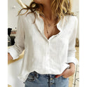 Light blue Makayla blouse by Lumina Wear featuring an airy, relaxed fit, displayed on a hanger against a neutral background.