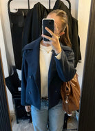 Maya Lumina cropped double-breasted trench coat with structured shoulders, stylish and tailored for a modern look.